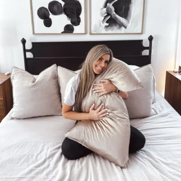 Corrine hugging her COOP pillow
