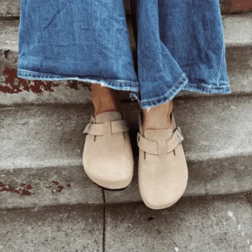 Corrine wearing designer-inspired clogs