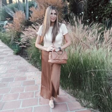 Corrine wearing a satin maxi skirt