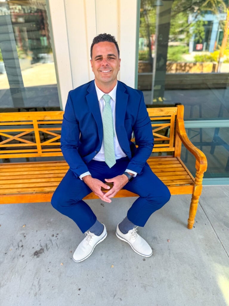 Neil wearing blue suit and floral tie
